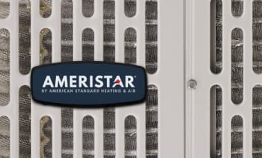 This is a closeup of an Ameristar home air conditioner unit with the blue company logo.